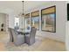 Bright dining room featuring modern light fixture, windows and table with six chairs at 2551 Kilgore Rd, Buford, GA 30519