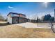 A modern two-story home with a three-car garage and large driveway, set against a backdrop of mature trees and blue skies at 2551 Kilgore Rd, Buford, GA 30519