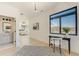 Bright hallway features a stylish desk area, bathroom access, and a view to the main bedroom with outside view at 2551 Kilgore Rd, Buford, GA 30519