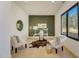 Stylish home office features a modern desk and floor-to-ceiling window with wooded views at 2551 Kilgore Rd, Buford, GA 30519
