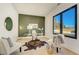 Stylish home office features a modern desk, and floor-to-ceiling window with outdoor views at 2551 Kilgore Rd, Buford, GA 30519