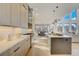 Spacious kitchen with a center island and views of the dining area and living space filled with light at 2551 Kilgore Rd, Buford, GA 30519