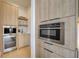 Modern kitchen features stainless steel appliances and light wood cabinets at 2551 Kilgore Rd, Buford, GA 30519