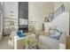 Bright living room with tall ceilings, modern fireplace, and staircase leading to a second story at 2551 Kilgore Rd, Buford, GA 30519