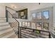 Spacious living room featuring large windows, modern decor, and an open layout with a view to the dining area at 2551 Kilgore Rd, Buford, GA 30519
