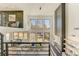 Spacious living room featuring large windows, modern decor, and an open layout with a view to the dining area at 2551 Kilgore Rd, Buford, GA 30519