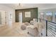 Stylish loft space featuring modern decor, comfortable seating, and bright windows at 2551 Kilgore Rd, Buford, GA 30519
