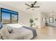 Large, bright main bedroom, hardwood floors, a fan, and a scenic view at 2551 Kilgore Rd, Buford, GA 30519