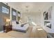 Spacious main bedroom with modern lighting, stylish decor, and ensuite bathroom access at 2551 Kilgore Rd, Buford, GA 30519