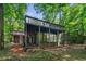 Two-story home with decks and screened in porch surrounded by forest at 3430 Rocky Springs Ct, Marietta, GA 30062