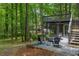 Seating area with furniture outside home with upper level deck and lush, wooded surroundings at 3430 Rocky Springs Ct, Marietta, GA 30062