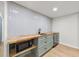 Basement bar area with a microwave, beverage cooler, and a tile backsplash at 3430 Rocky Springs Ct, Marietta, GA 30062