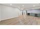 Open basement design with wet bar, recessed lights, and light wood-look flooring at 3430 Rocky Springs Ct, Marietta, GA 30062