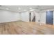Spacious basement area with wood-look floors, neutral walls, and access to the upper level via stairs at 3430 Rocky Springs Ct, Marietta, GA 30062