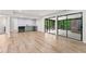 Finished basement with wet bar, slider doors, and light wood-look flooring at 3430 Rocky Springs Ct, Marietta, GA 30062
