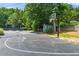 Outdoor basketball court near shed and picnic area surrounded by lush trees, offering recreational activities at 3430 Rocky Springs Ct, Marietta, GA 30062