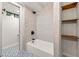 Bathroom showcasing a tub with black hardware and convenient open wooden shelving at 3430 Rocky Springs Ct, Marietta, GA 30062