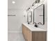 Bright bathroom features a double sink vanity, modern lighting, and hexagon tile floor at 3430 Rocky Springs Ct, Marietta, GA 30062