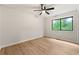 Bright bedroom featuring a ceiling fan, window, and light wood-look flooring at 3430 Rocky Springs Ct, Marietta, GA 30062