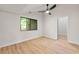 Bedroom featuring ceiling fan, window view, and light wood-look flooring at 3430 Rocky Springs Ct, Marietta, GA 30062