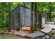 Home exterior features a garage, wood siding, stone landscaping, and a walking path at 3430 Rocky Springs Ct, Marietta, GA 30062