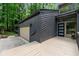 Exterior of home features front door, garage, and angular, wood siding at 3430 Rocky Springs Ct, Marietta, GA 30062