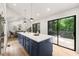 Kitchen featuring a large island with bar seating and a sliding glass door to the deck for entertaining at 3430 Rocky Springs Ct, Marietta, GA 30062
