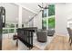 Bright open landing with modern decor, hardwood floors, and large windows for natural light at 3430 Rocky Springs Ct, Marietta, GA 30062