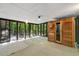 Spacious sunroom with walls of windows, a wood sauna, and access to the outdoors at 3430 Rocky Springs Ct, Marietta, GA 30062