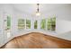 Sun-filled breakfast nook surrounded by windows and a door leading to the outdoor area at 5190 Beech Forest Sw Dr, Lilburn, GA 30047