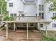 Backyard patio featuring a spacious deck, lush greenery, providing a perfect outdoor retreat at 5190 Beech Forest Sw Dr, Lilburn, GA 30047