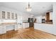 Spacious kitchen with stainless steel appliances, breakfast bar, workstation, and laundry area at 5190 Beech Forest Sw Dr, Lilburn, GA 30047