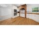 Kitchen with white cabinetry, stainless steel appliances, and a brick alcove above the stove at 5190 Beech Forest Sw Dr, Lilburn, GA 30047