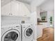 Laundry room featuring side by side washer and dryer and a view to the breakfast nook at 5190 Beech Forest Sw Dr, Lilburn, GA 30047