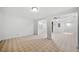 Open living room offers natural light, white walls, and carpeted floors throughout at 5190 Beech Forest Sw Dr, Lilburn, GA 30047