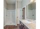 Beautiful bathroom with a shower, stylish vanity, and plank flooring at 2317 Church Street, Hampton, GA 30228