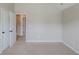 Bedroom with neutral walls, closet doors, and carpeted floors that creates a calm space at 2317 Church Street, Hampton, GA 30228