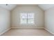 Spacious bedroom with neutral walls, window providing natural light, and carpeted floors at 2317 Church Street, Hampton, GA 30228