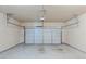 Spacious garage with a clean floor and a white garage door at 2317 Church Street, Hampton, GA 30228