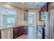 Well-equipped kitchen featuring stainless steel appliances, granite countertops, and ample cabinet space at 2317 Church Street, Hampton, GA 30228