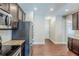 Kitchen with stainless steel appliances, granite countertops and a walk-through to the entryway at 2317 Church Street, Hampton, GA 30228