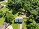 Aerial view of a home featuring a spacious backyard, deck, and separate storage shed at 319 Hill Crest Cir, Woodstock, GA 30188