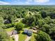 An aerial view showing the property's location within a lush, wooded neighborhood at 319 Hill Crest Cir, Woodstock, GA 30188