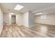 Large basement area with ample space for activities, finished with wood-look flooring at 319 Hill Crest Cir, Woodstock, GA 30188