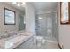 Updated bathroom with a walk-in shower, granite countertop, and modern fixtures at 319 Hill Crest Cir, Woodstock, GA 30188