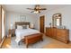 Bedroom with wood floors, a ceiling fan, and classic furnishings creating a comfortable ambiance at 319 Hill Crest Cir, Woodstock, GA 30188