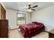 Bedroom with a ceiling fan and natural light, creating a relaxing atmosphere at 319 Hill Crest Cir, Woodstock, GA 30188