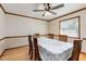 Traditional dining room with wood floors and wainscotting, and a dining table set for six at 319 Hill Crest Cir, Woodstock, GA 30188