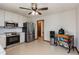 Functional kitchen featuring stainless steel appliances, white cabinets, tile backsplash, and tile flooring at 319 Hill Crest Cir, Woodstock, GA 30188