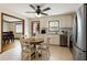 Bright kitchen with stainless steel appliances, tile backsplash, and an adjacent dining area at 319 Hill Crest Cir, Woodstock, GA 30188